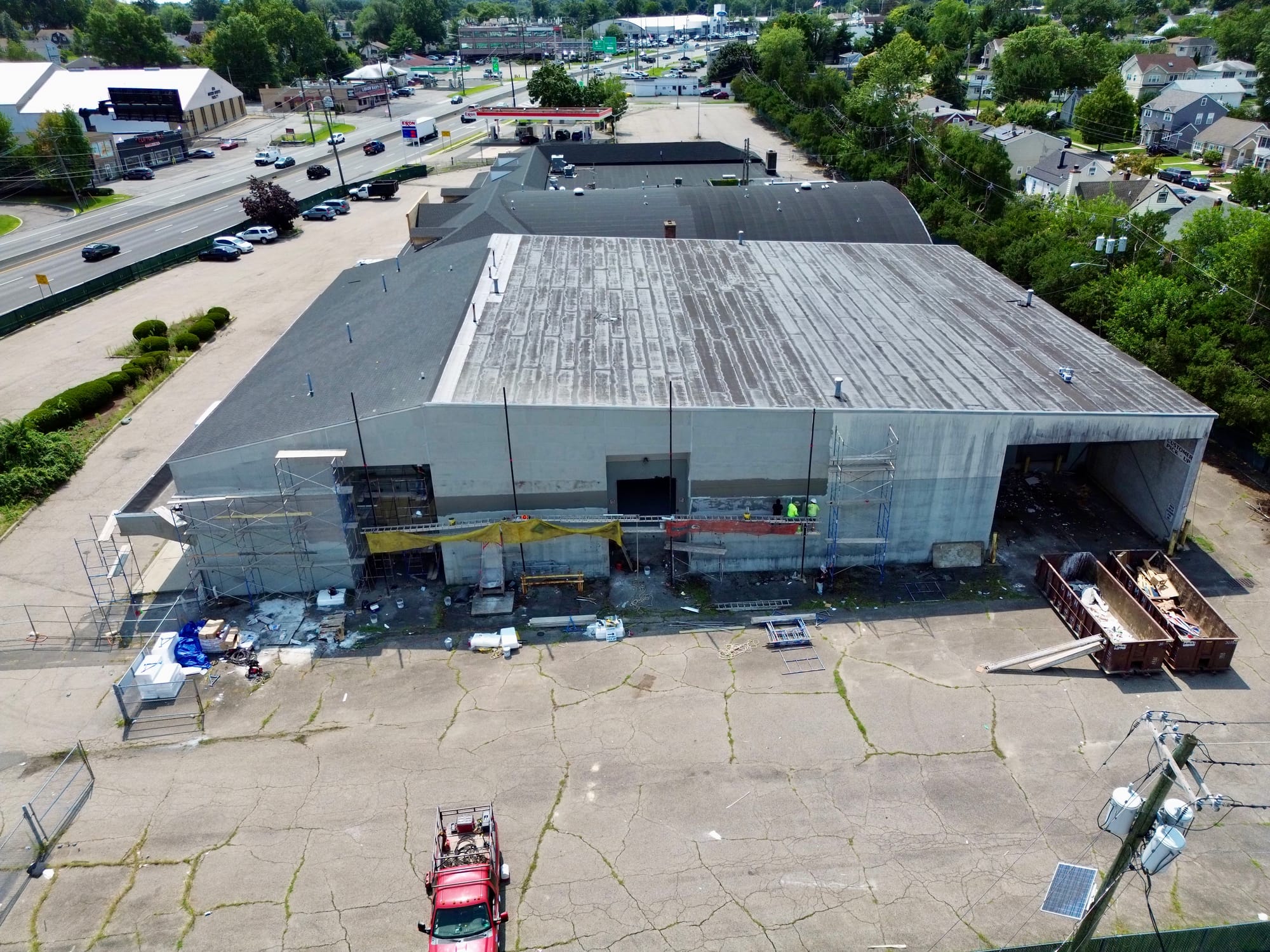The same elevation from further back, the anchor building and its open bay under construction