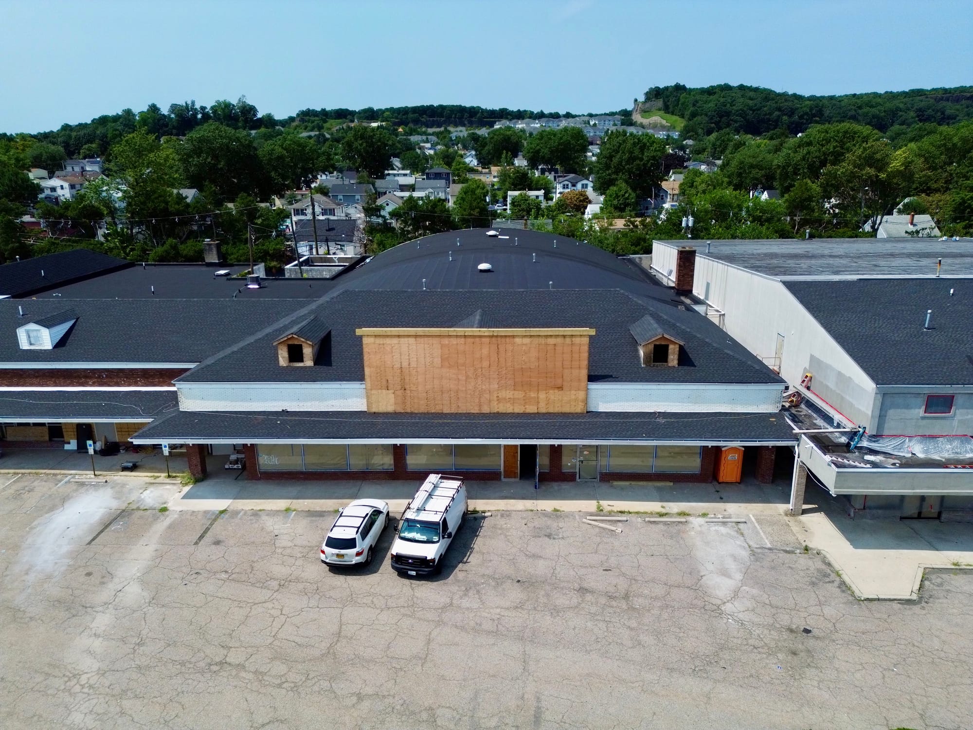Storefront range at the plaza with work under way at the far end