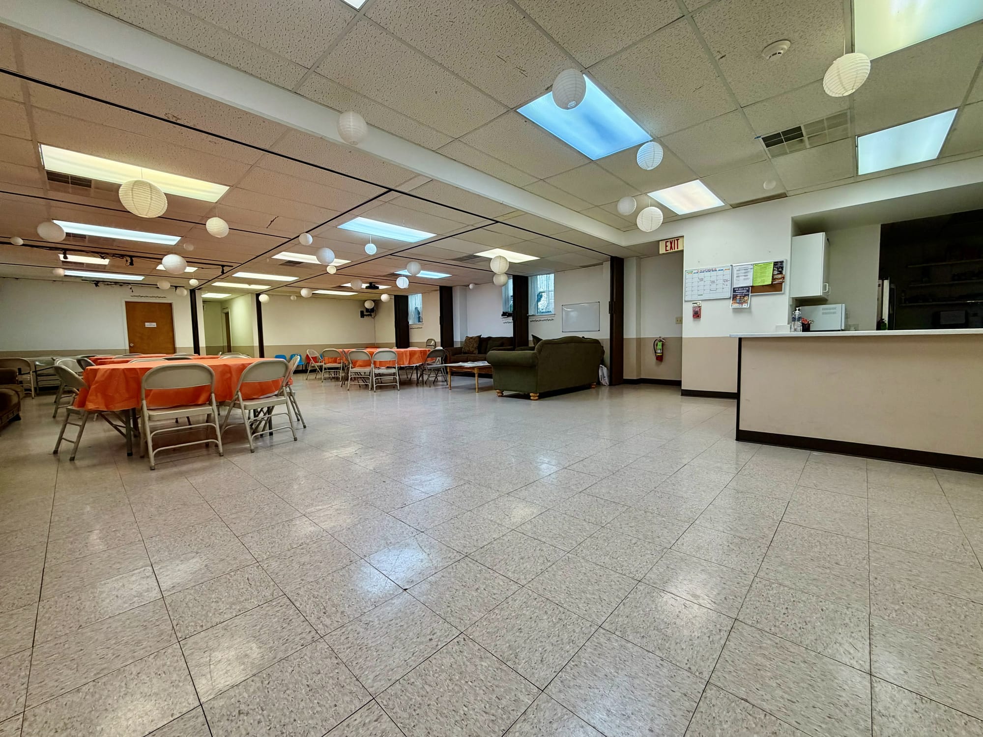 Before: hall looking toward the servery pass-through and its dated laminate counter