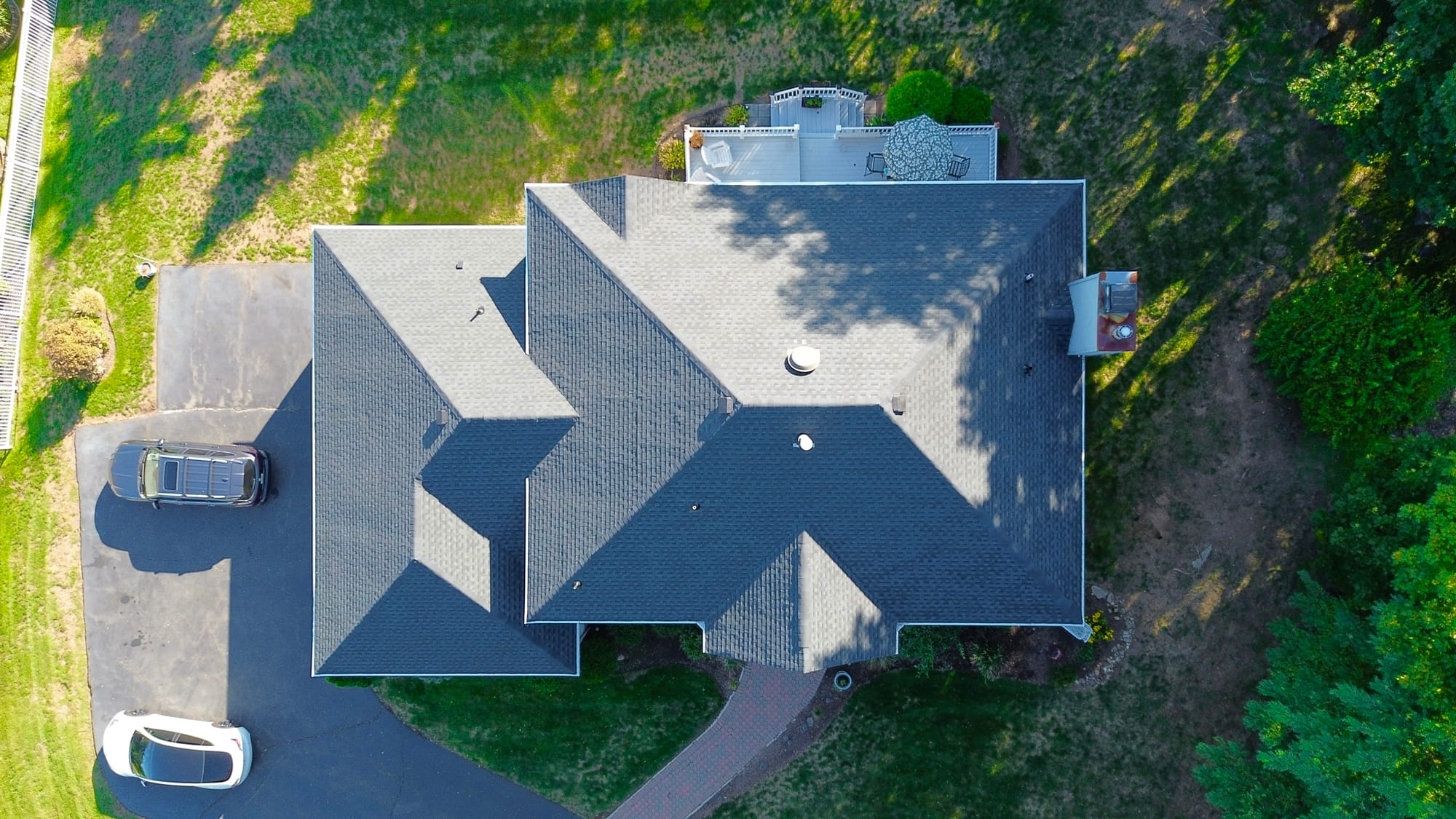 After: plan view of the completed roof, clean courses and ridge lines through every valley