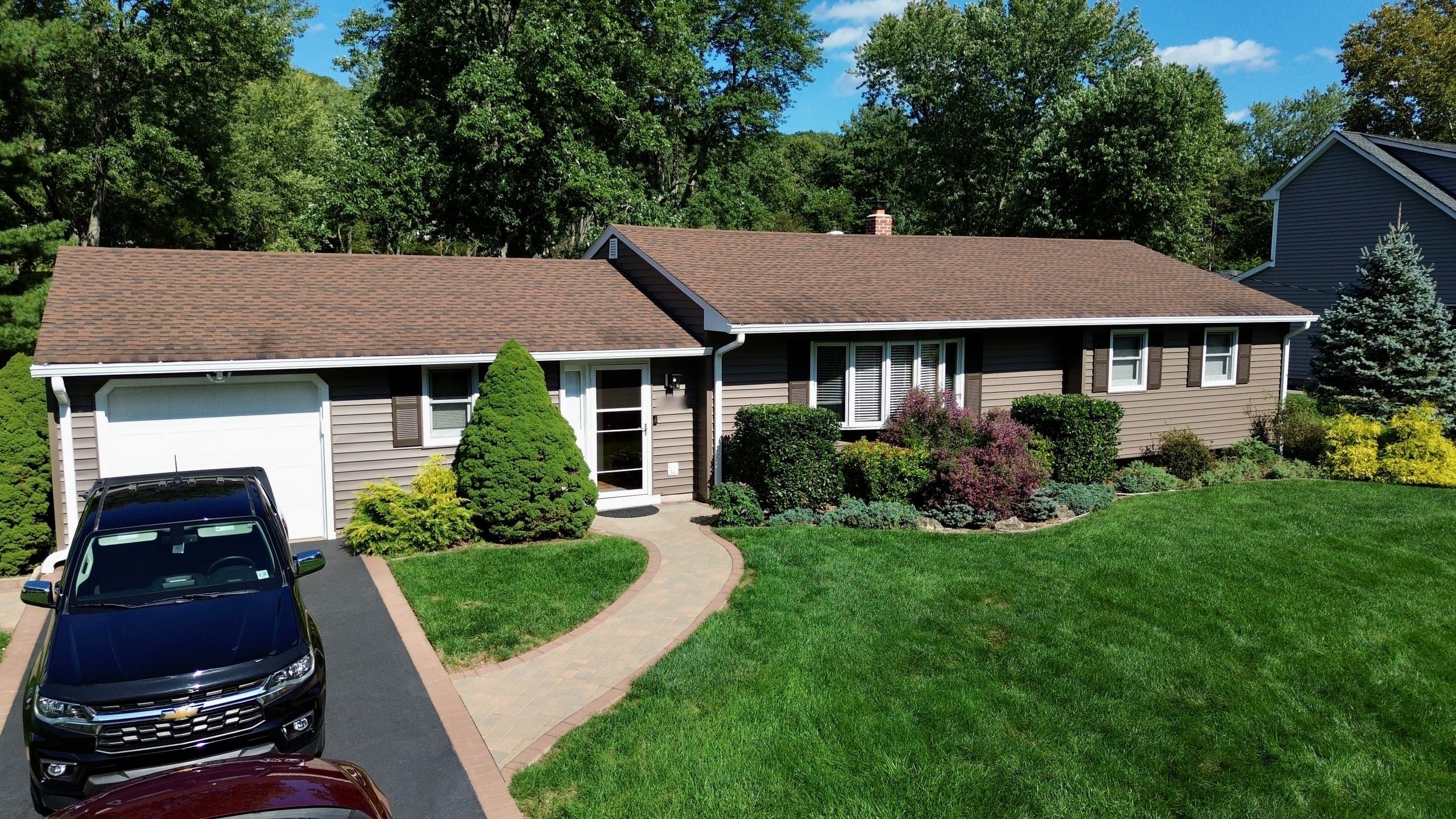 Completed vinyl siding and gutter replacement on a house in Bridgewater, New Jersey