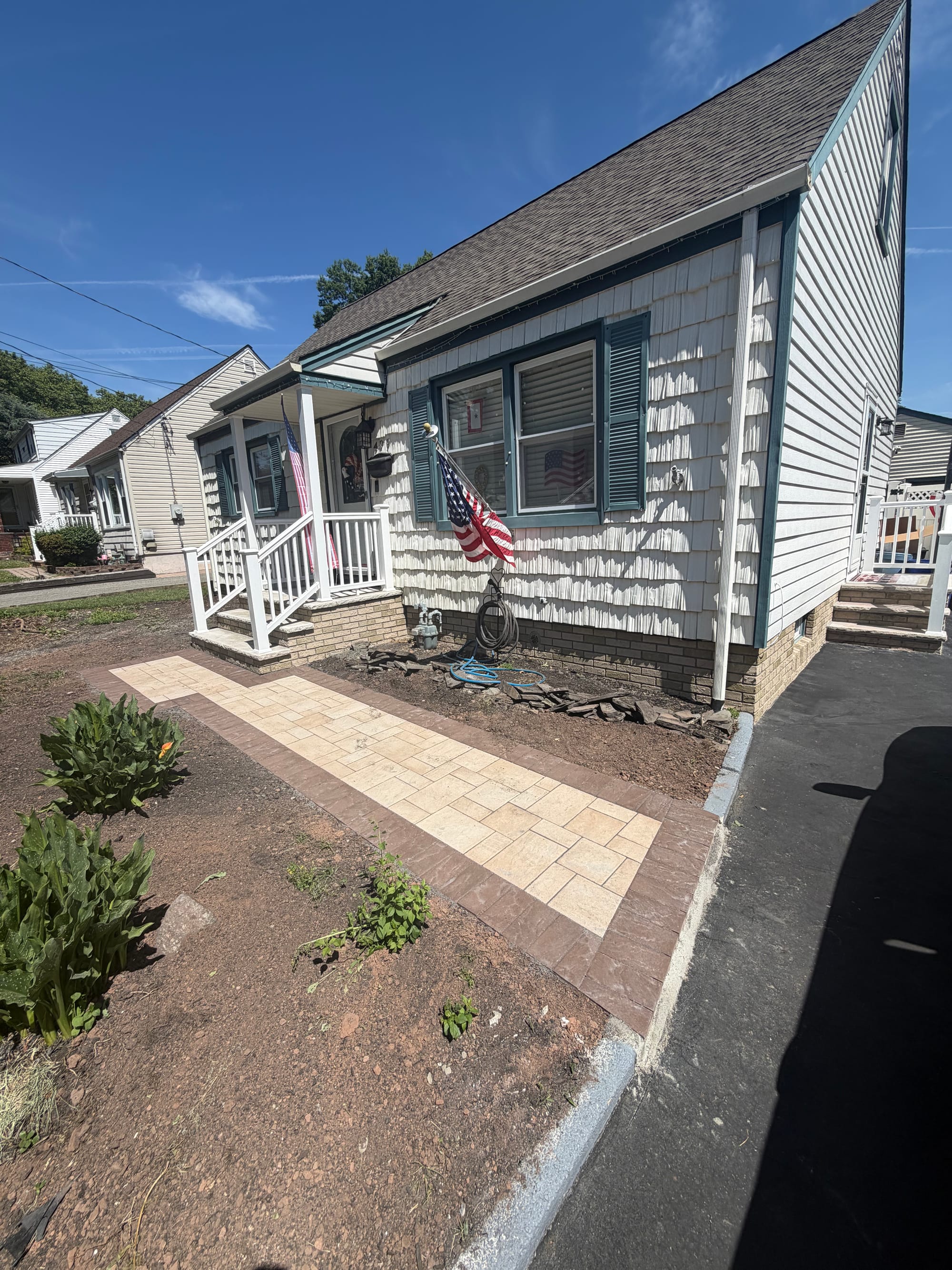 After: the new paver walk running from the sidewalk to the porch, soldier-course border either side